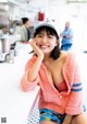 A woman sitting at a counter in a diner.